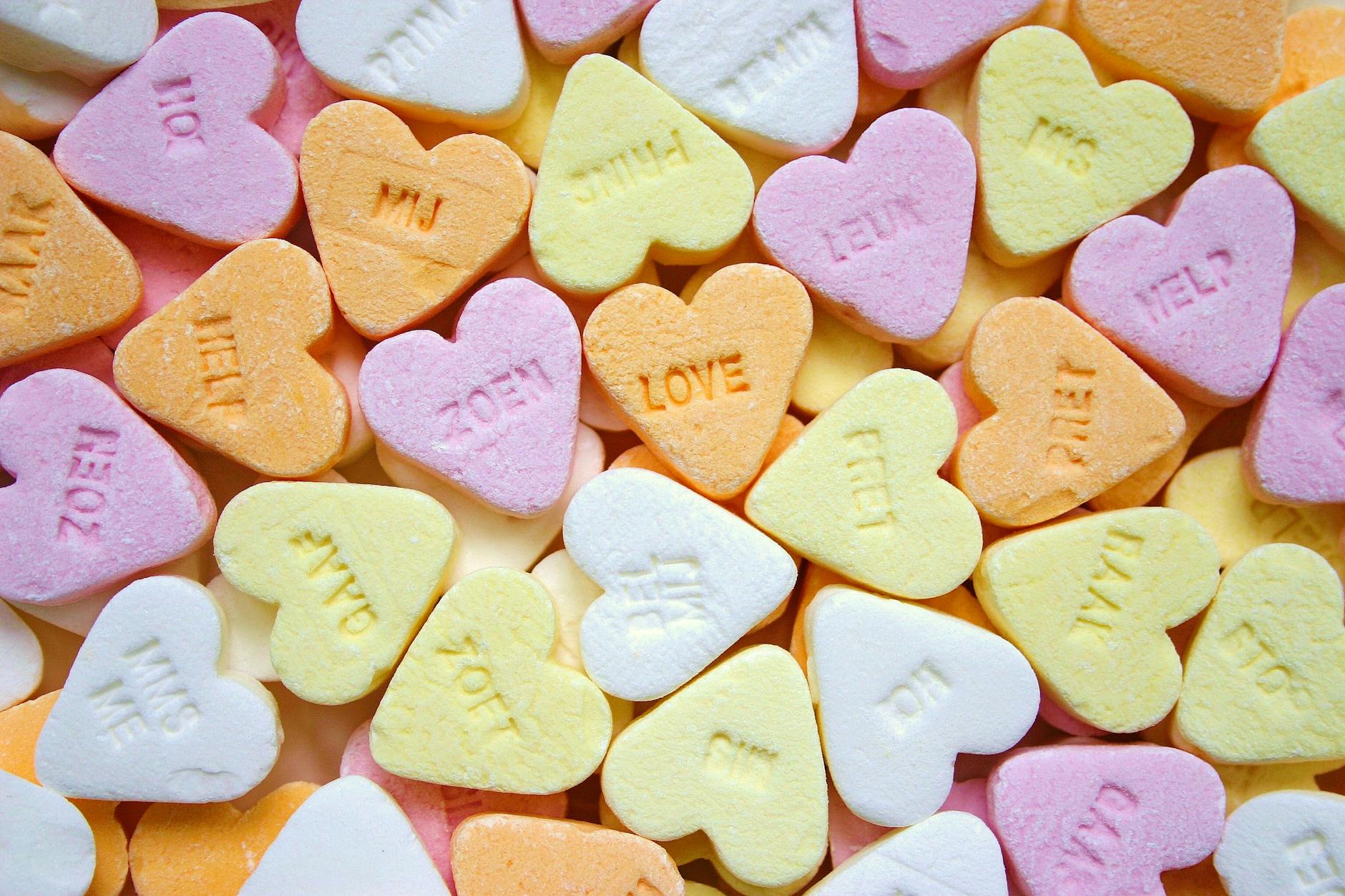 yellow pink orange and white loves heart candies